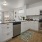 Model kitchen at The Ivy at Draper 55 and over Apartments in Draper, UT, featuring stainless steel appliances.