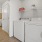 a laundry room with shelving