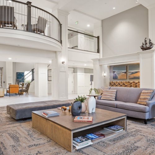 State-of-the-art amenities Resident lounge at The Ivy at Draper 55 and over Apartments in Draper, UT, featuring wood grain floor paneling.
