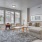 Model living room at The Ivy at Draper 55 plus community in Utah, featuring wood grain flooring and counter seating.