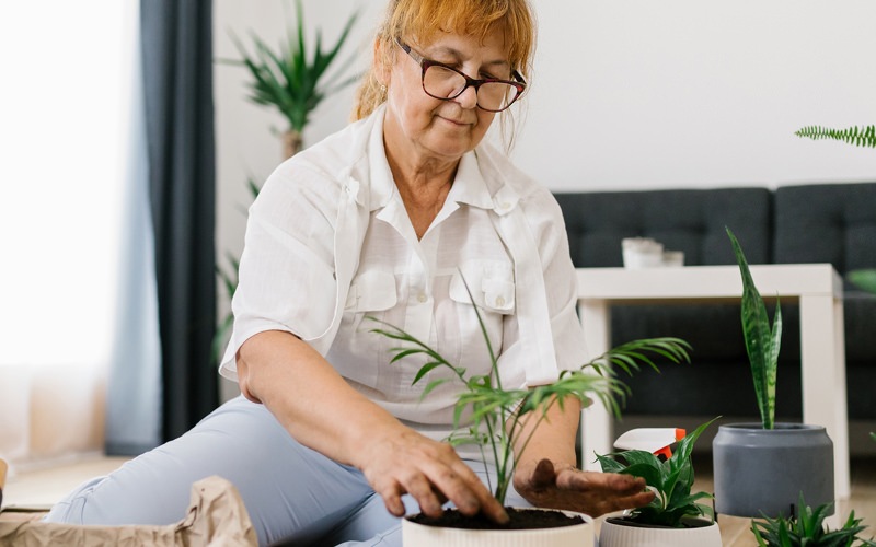Woman potting plants
